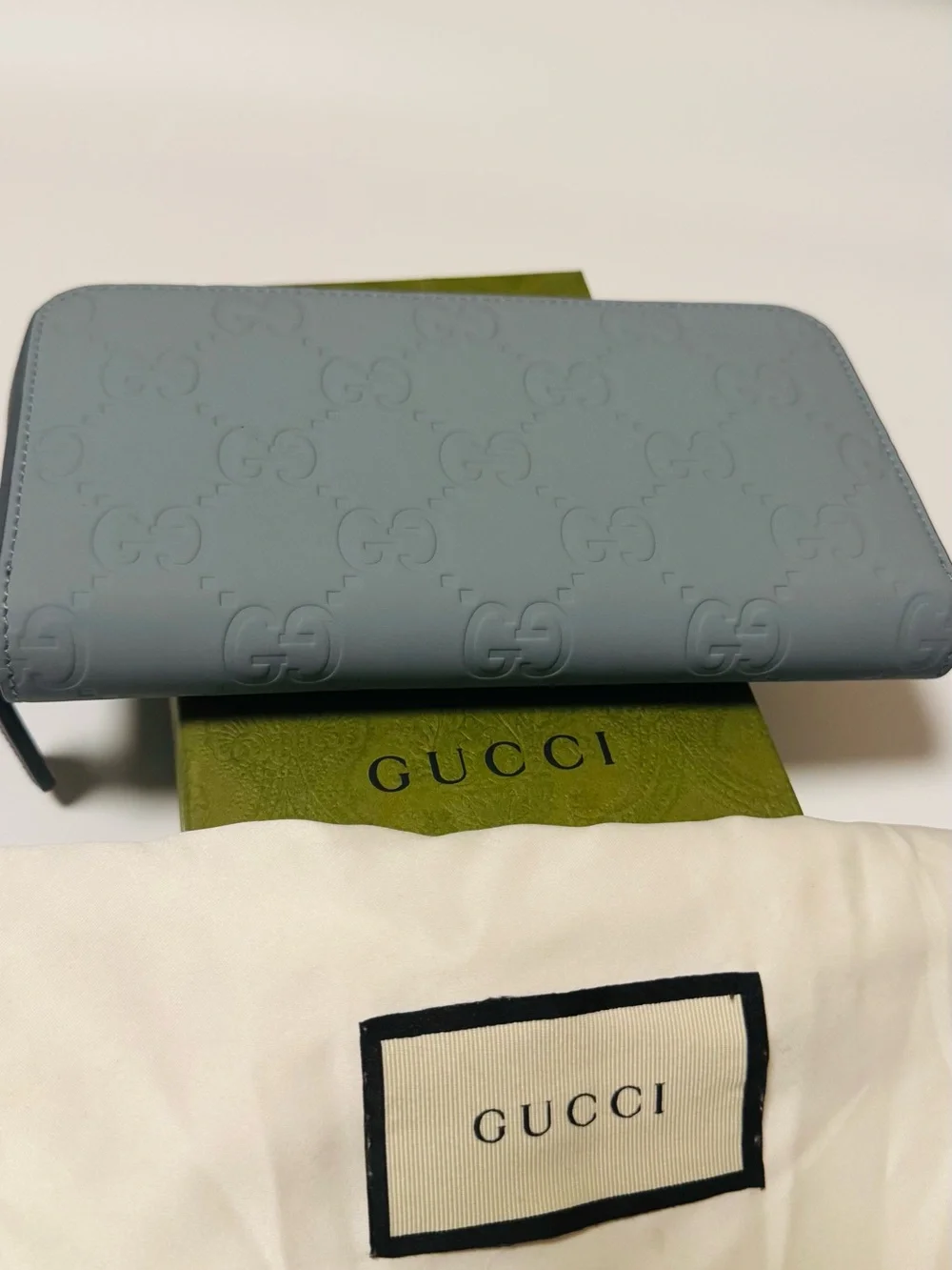 Gucci Light Blue Embossed GG Zip-Around Wallet